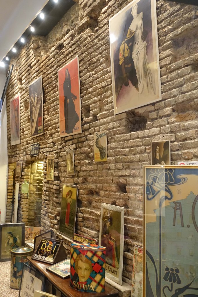 Bologna city wall visible in a shop